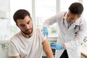 Man received a flu shot from a medical professional