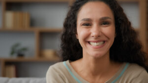 Close-up of woman smiling brightly at camera